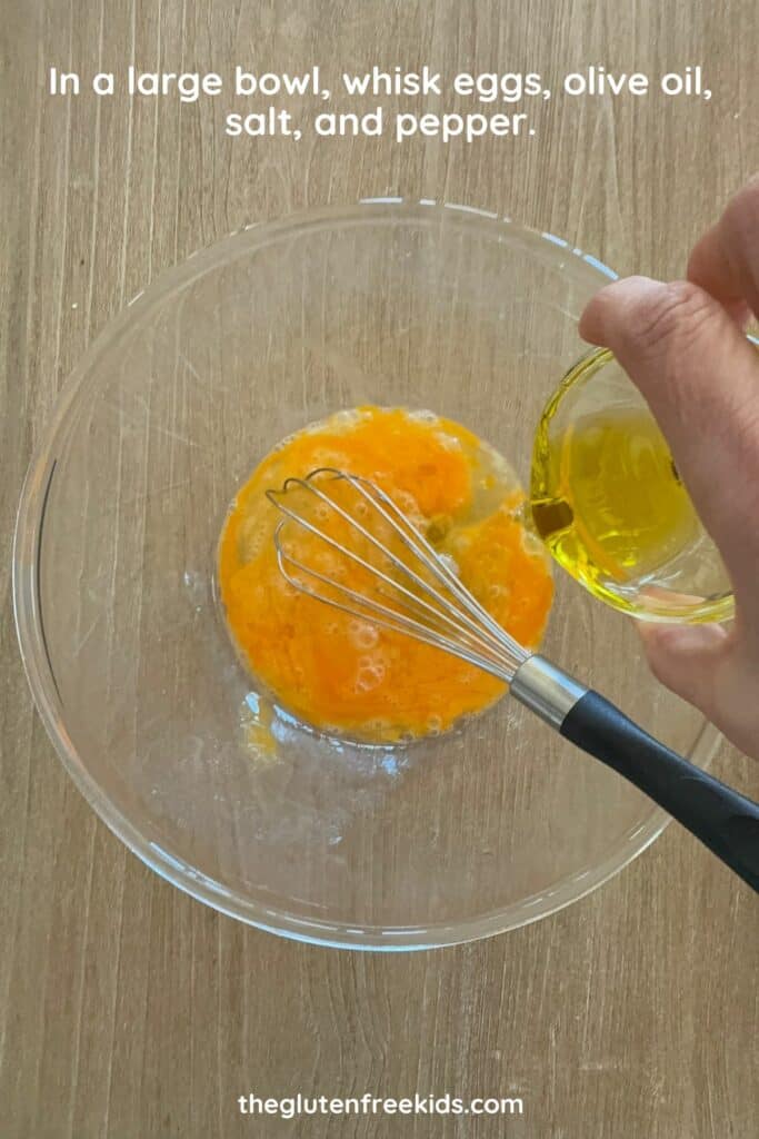 Eggs, oil, salt, and pepper whisked together in a mixing bowl