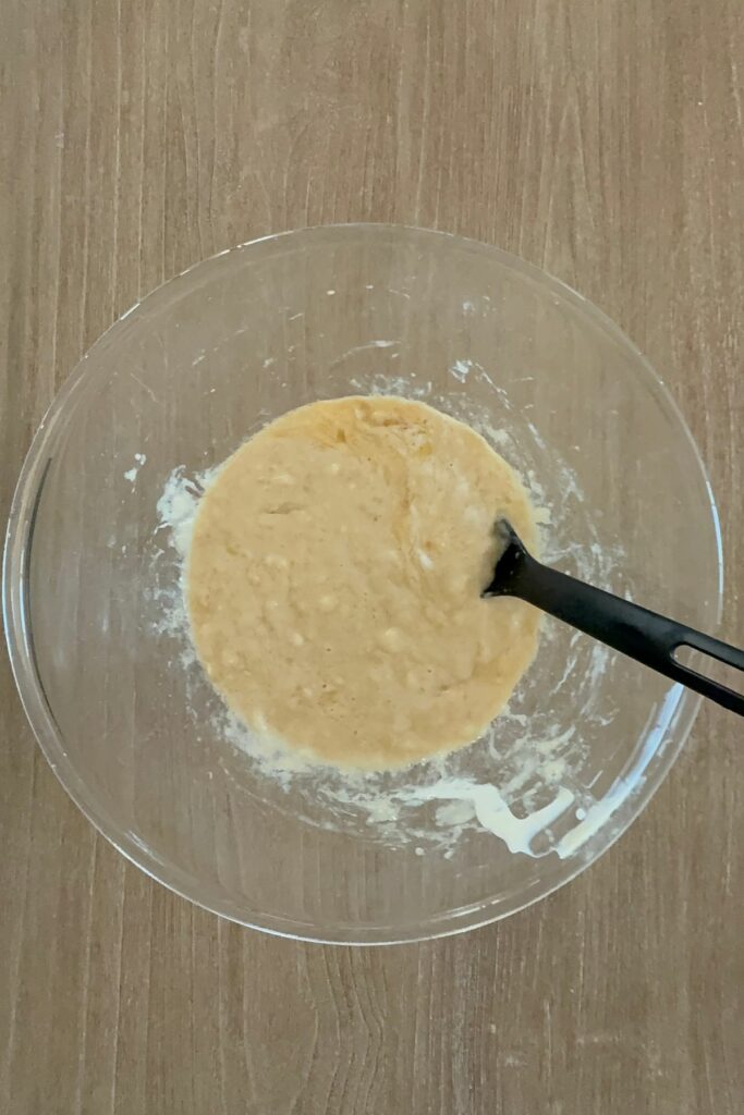 Whisk in eggs, oil, yogurt, sugar, and vanilla until smooth.