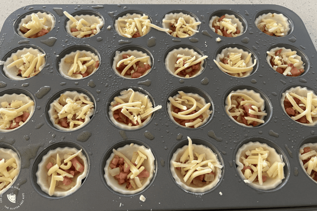 Add bacon and cheese to mini quiches