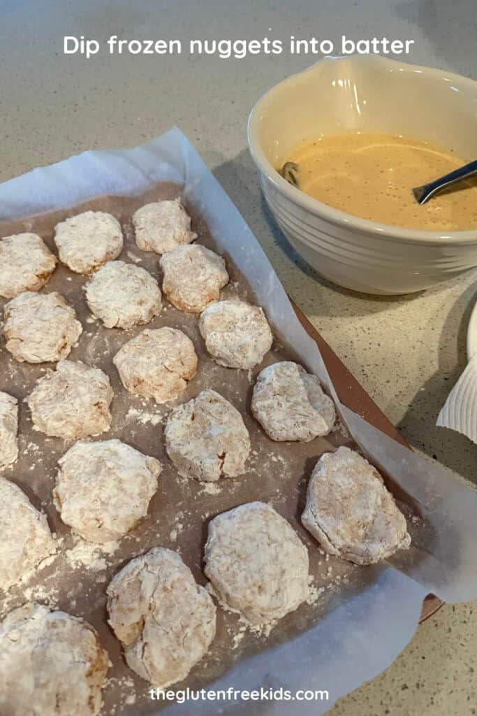 Dip frozen nuggets into batter, let the excess drip off, then carefully place in hot oil.