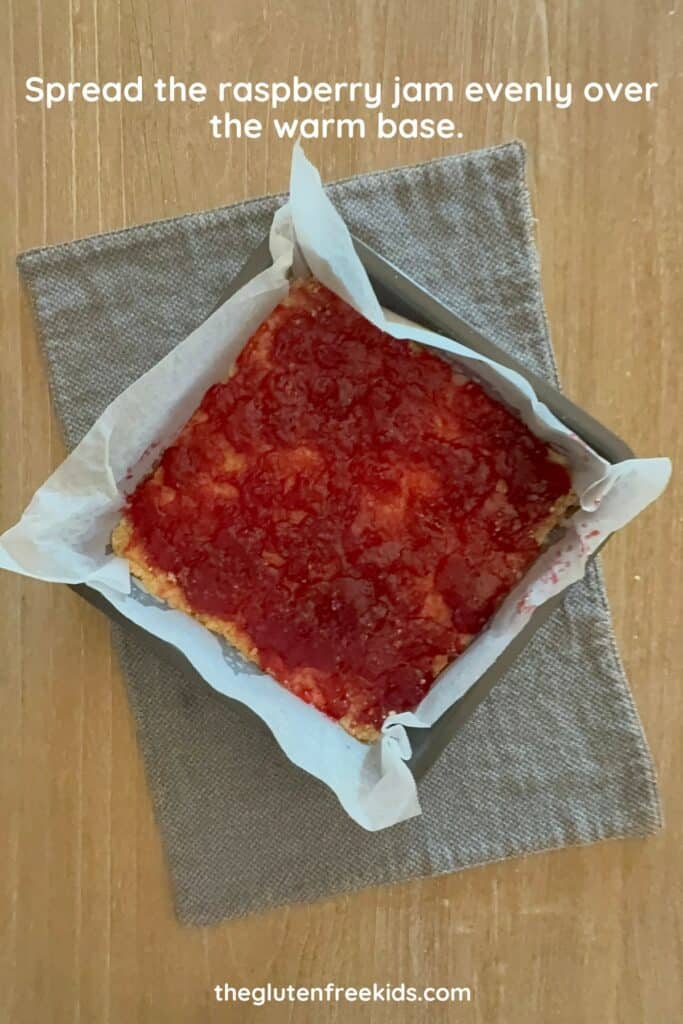 spread the jam over the gluten-free Raspberry Crumble Base