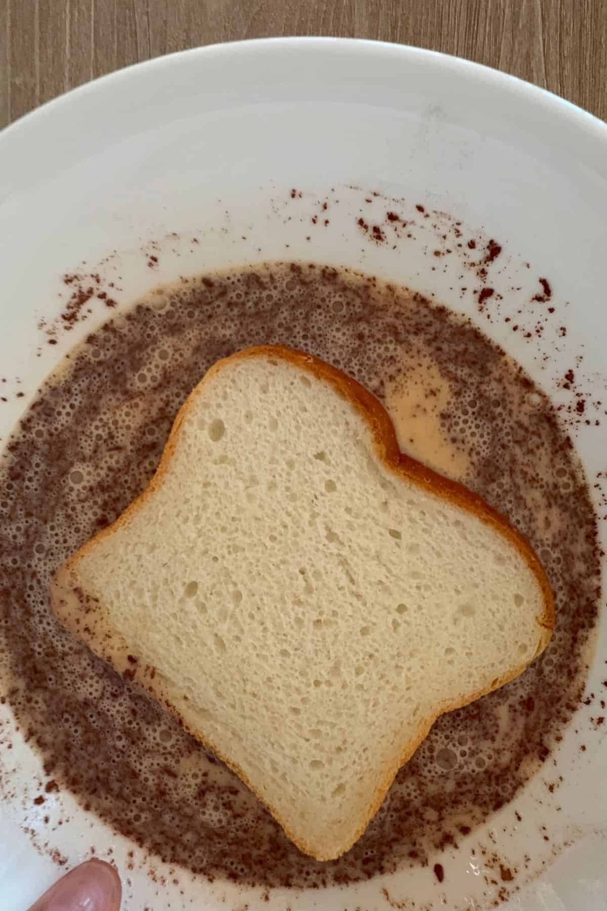 Dip the bread slices into the mixture, coating both sides evenly.