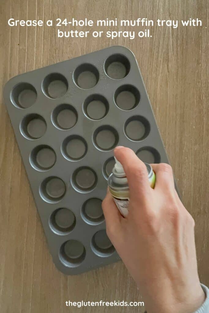 Grease a 24-hole mini muffin tray with butter or spray oil.