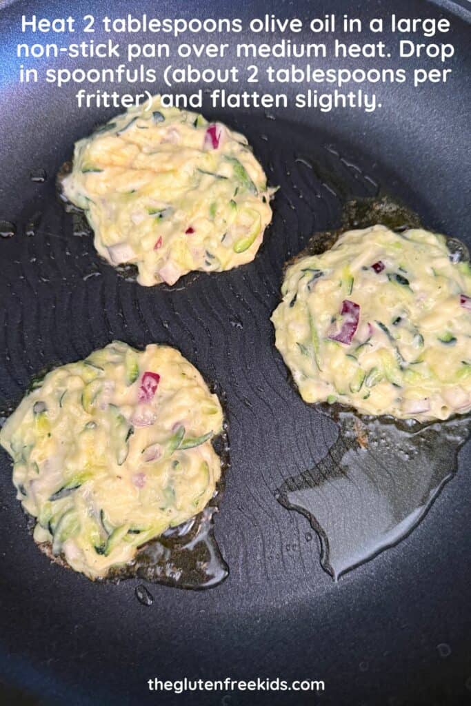 cooking zucchini fritters in pan