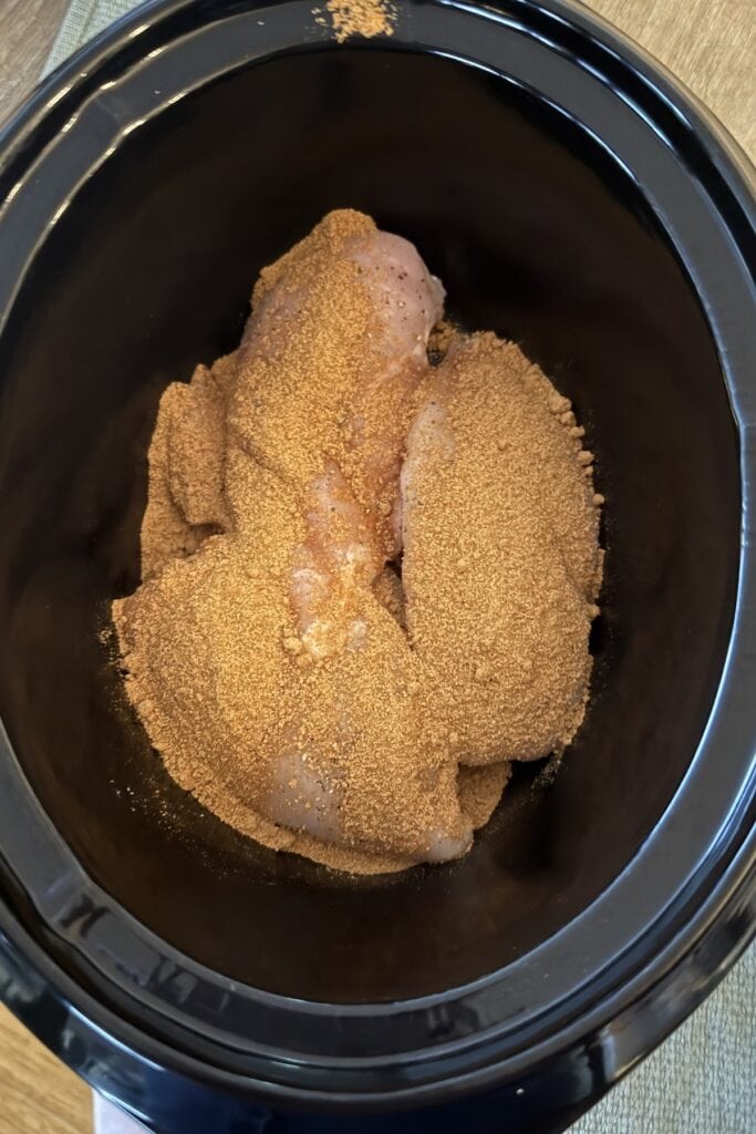 Chicken breasts in slow cooker, and sprinkle over the gluten-free fajita seasoning