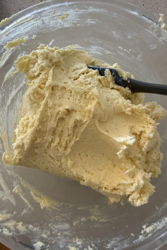 Gradually add gluten-free flour and mix until a soft dough forms