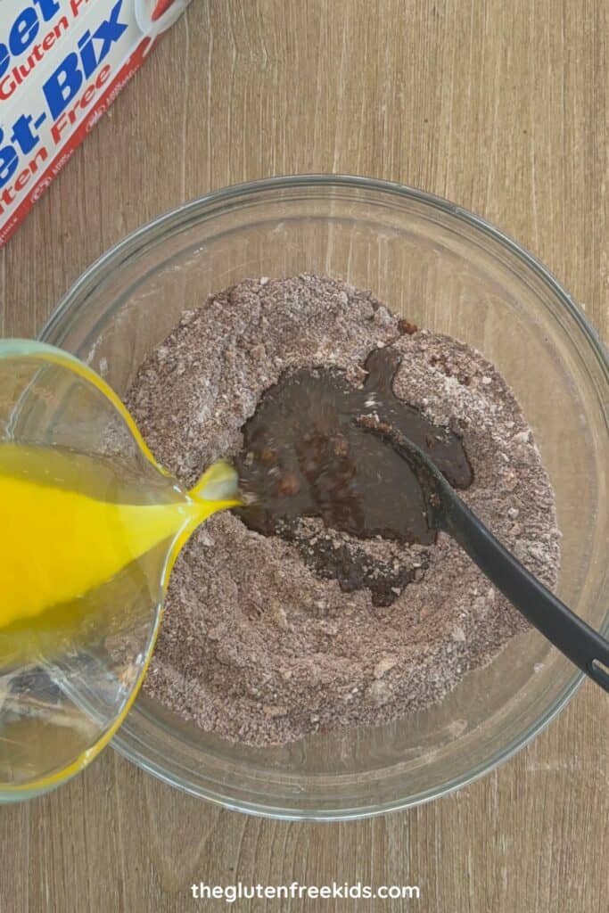 Pour in the melted butter and vanilla extract.