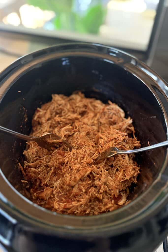 stir the shredded chicken back through the sauce until evenly coated